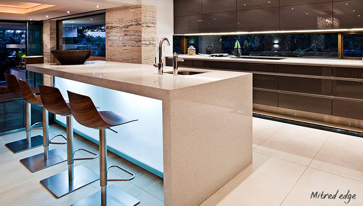 Under-lit waterfall edge on ceaser stone kitchen countertop. 